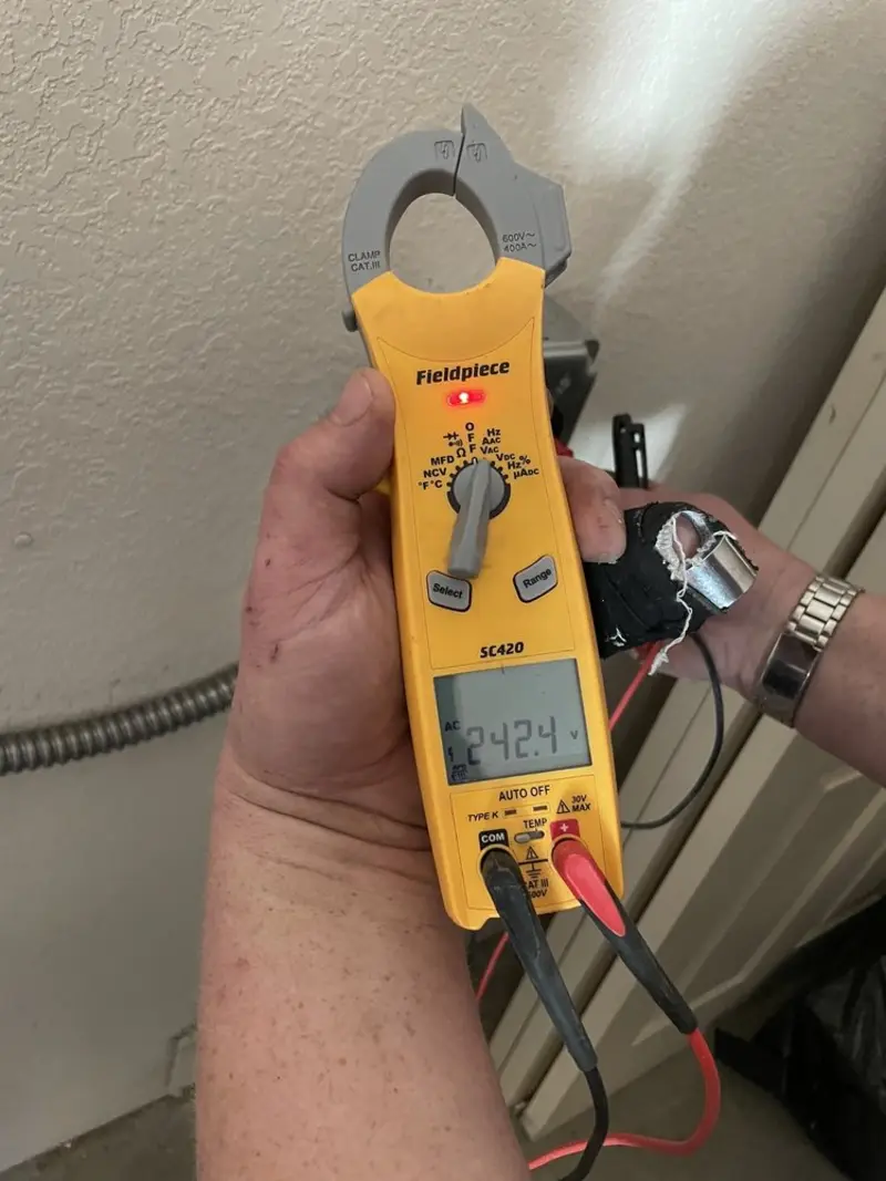 Voltage testing with clamp meter during Ceiling Fan Installation in San Carlos